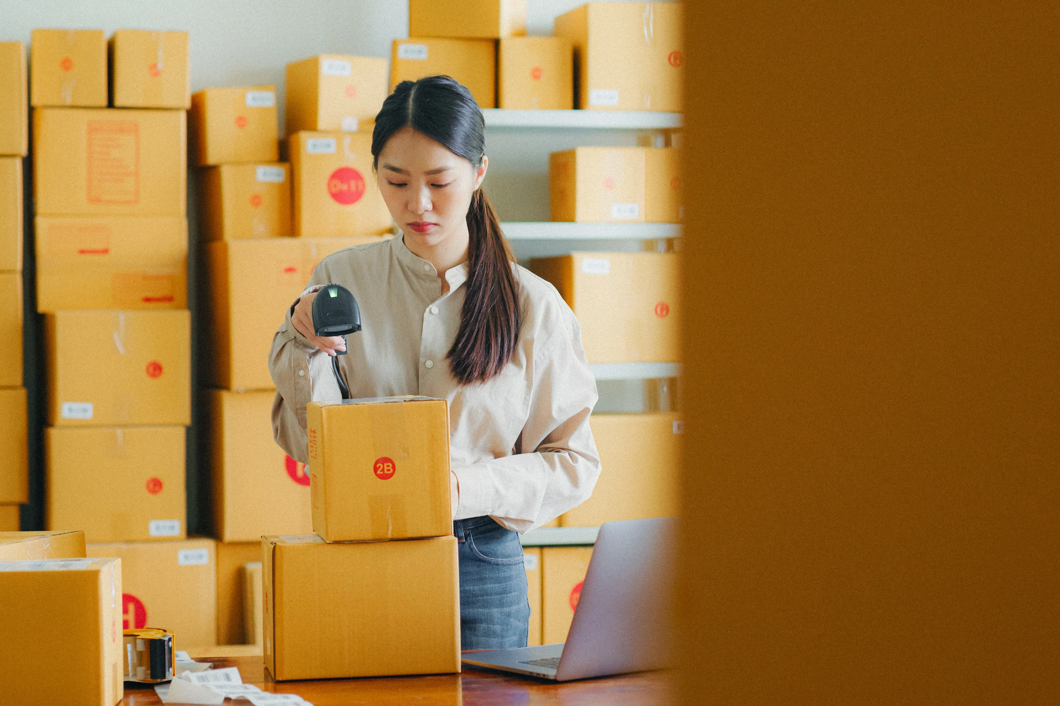 Woman scanning a barcode of an item